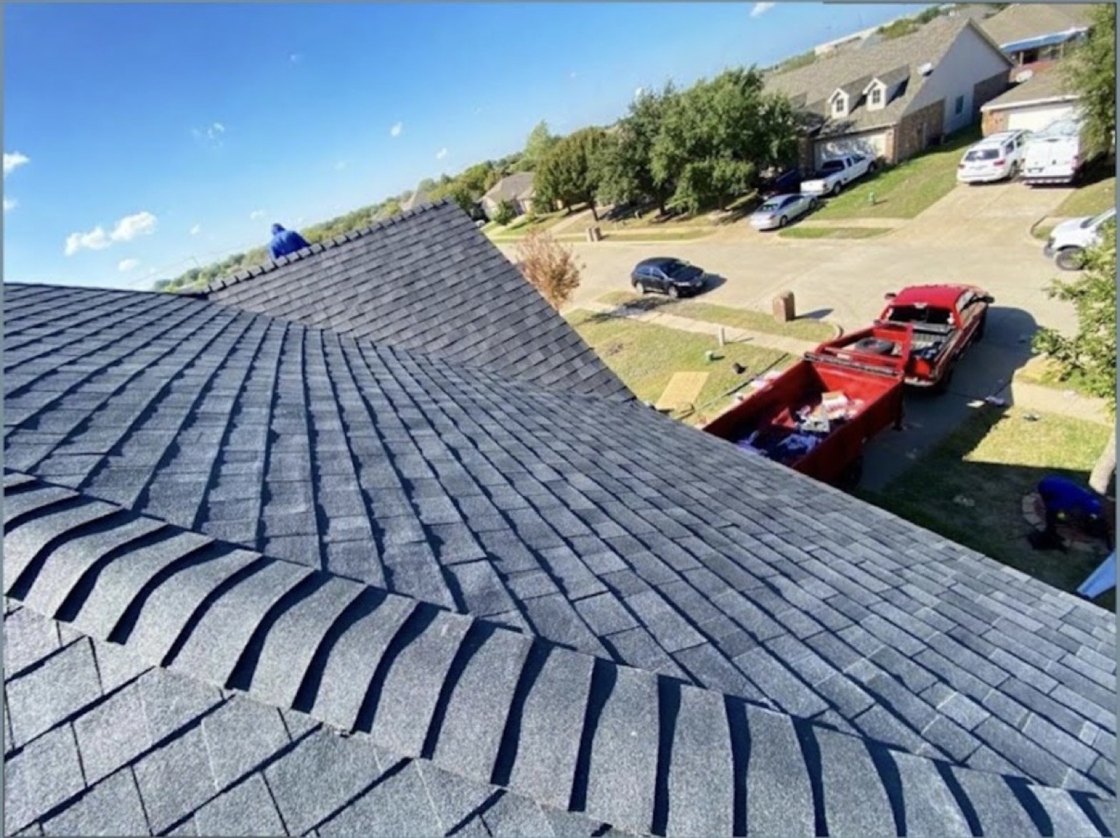 Aerial view of a finished residential shingle roof